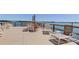 The outdoor lounge area on the dock offers serene water views, providing a delightful setting for relaxation and social gatherings at 1847 Shore Drive South # 308, South Pasadena, FL 33707