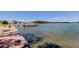 A scenic view of the waterfront from the dock, featuring a charming walkway and views of the city skyline at 1847 Shore Drive South # 308, South Pasadena, FL 33707