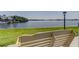 Relaxing waterfront view from a community bench, offering a serene spot for leisure and reflection at 1847 Shore Drive South # 308, South Pasadena, FL 33707