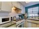 Charming kitchen area with vintage style appliances and a cozy atmosphere at 1847 Shore Drive South # 308, South Pasadena, FL 33707