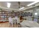 Well-stocked library with comfortable seating and tables for residents to relax and enjoy reading at 1847 Shore Drive South # 308, South Pasadena, FL 33707