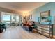 Inviting living room featuring water views, bright light, and a stylish mirror chest at 1847 Shore Drive South # 308, South Pasadena, FL 33707