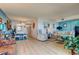 Open-concept living and dining area featuring a neutral color palette and contemporary furnishings at 1847 Shore Drive South # 308, South Pasadena, FL 33707