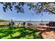Outdoor dining and grilling space with water views, offering an ideal setting for relaxation and community gatherings at 1847 Shore Drive South # 308, South Pasadena, FL 33707