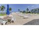 Community patio with bay views, lounge chairs, and ample space for outdoor gatherings and leisurely relaxation at 1847 Shore Drive South # 308, South Pasadena, FL 33707