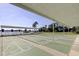 Enjoy these community shuffleboard courts with water views and covered seating areas for neighbors and guests to enjoy at 1847 Shore Drive South # 308, South Pasadena, FL 33707