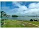 Scenic water view showcasing a marina, lush green space, and a clear, blue sky at 1847 Shore Drive South # 308, South Pasadena, FL 33707
