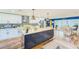 Well-designed kitchen with a large island, white cabinets, and open concept design at 1851 Glenville Dr, Clearwater, FL 33765