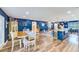 Spacious living space featuring a dining room and an island kitchen with dark blue accent colors at 1851 Glenville Dr, Clearwater, FL 33765
