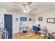 Functional home office with desk, stylish chair, laundry machine, and nautical-themed decor at 1851 Glenville Dr, Clearwater, FL 33765