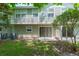 The backyard features a patio, verdant grass, and building with light green siding at 220 Sawtooth Dr, Valrico, FL 33594