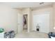 Bright bedroom features carpet floors, closet, and access to an adjacent hallway at 220 Sawtooth Dr, Valrico, FL 33594