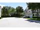 Exterior facade of townhome featuring siding, attached garage and driveway, and manicured landscaping in a gated community at 220 Sawtooth Dr, Valrico, FL 33594