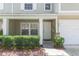 Close up front door and porch with charming landscaping and stone accents at 220 Sawtooth Dr, Valrico, FL 33594