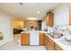 Spacious kitchen with a breakfast bar, dishwasher, and open view to the dining and living spaces at 220 Sawtooth Dr, Valrico, FL 33594