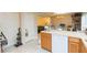 Extended kitchen island with dishwasher, and open view to the dining and living spaces at 220 Sawtooth Dr, Valrico, FL 33594