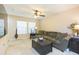 Inviting living room with neutral tones, a plush green sofa, and ample natural light from the window at 220 Sawtooth Dr, Valrico, FL 33594