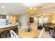 Open-concept space connecting a dining area, kitchen, and living room, perfect for modern living at 220 Sawtooth Dr, Valrico, FL 33594