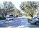 Charming street view showcasing tree-lined street, sidewalks, and well-maintained townhomes in a friendly neighborhood at 220 Sawtooth Dr, Valrico, FL 33594