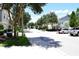 A quiet street view of townhomes in a beautiful neighborhood with tree coverage and well-manicured landscaping at 220 Sawtooth Dr, Valrico, FL 33594