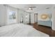 Bright bedroom with neutral decor features hardwood floors, stylish furnishings, and ample natural light at 2904 W Averill Ave, Tampa, FL 33611