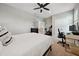 Bedroom with neutral paint, carpet, and desk with modern computer setup at 2904 W Averill Ave, Tampa, FL 33611