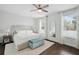 Bright bedroom with neutral decor features hardwood floors, stylish furnishings, and ample natural light at 2904 W Averill Ave, Tampa, FL 33611