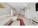 Bright living room with neutral paint, carpet, and stylish furniture at 2904 W Averill Ave, Tampa, FL 33611