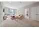 Cozy living room features neutral paint, carpet, and blue patterned curtains at 2904 W Averill Ave, Tampa, FL 33611