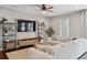 Relaxing living room with a comfortable sectional sofa, modern shelving, and a stylish coffee table on a jute rug at 2904 W Averill Ave, Tampa, FL 33611