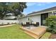 Cozy backyard deck with outdoor seating, perfect for relaxing and entertaining at 2910 W Aquilla St, Tampa, FL 33629