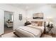Cozy bedroom with neutral decor, decorative pillows, and soft rug at 2910 W Aquilla St, Tampa, FL 33629