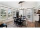 Elegant dining room featuring stylish chandelier, large windows and modern decor at 2910 W Aquilla St, Tampa, FL 33629