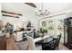 Bright dining area with modern lighting, wood floors, and comfortable seating at 2910 W Aquilla St, Tampa, FL 33629