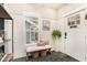 Stylish entryway featuring shiplap walls, a window bench, and elegant decor at 2910 W Aquilla St, Tampa, FL 33629