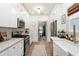 Bright and airy kitchen with white cabinets, stainless steel appliances, and stylish fixtures and decor at 2910 W Aquilla St, Tampa, FL 33629