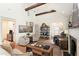 Spacious living room featuring wood flooring, beamed ceilings and natural light at 2910 W Aquilla St, Tampa, FL 33629