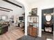 Open-concept living space with wood floors, high ceilings, and stylish furnishings at 2910 W Aquilla St, Tampa, FL 33629