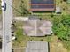 Aerial view of a home with a neutral toned roof, surrounded by green foliage and neighboring homes at 2920 E 20Th Ave, Tampa, FL 33605