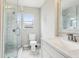 Bathroom featuring glass enclosed shower, marbled tiles, and modern vanity at 2920 E 20Th Ave, Tampa, FL 33605