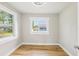 Cozy bedroom with new windows providing plenty of natural light and wood-look floors at 2920 E 20Th Ave, Tampa, FL 33605