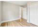 Neutral bedroom with closet, new floors, and a doorway to another room at 2920 E 20Th Ave, Tampa, FL 33605