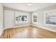 Bright bedroom with hardwood floors, fresh paint, and windows offering natural light at 2920 E 20Th Ave, Tampa, FL 33605