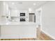 Modern kitchen featuring white cabinets, quartz countertops, and stainless steel appliances at 2920 E 20Th Ave, Tampa, FL 33605