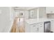 Updated kitchen with quartz countertops, stainless steel appliances, and open layout to the living area at 2920 E 20Th Ave, Tampa, FL 33605