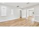 Open living area with light-colored walls, hardwood floors, and seamlessly connected to the rest of the home at 2920 E 20Th Ave, Tampa, FL 33605