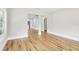 Spacious living room with light gray walls, pristine hardwood floors, and an open floor plan at 2920 E 20Th Ave, Tampa, FL 33605