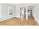 Bright living room boasts gleaming hardwood floors and abundant natural light, flowing into kitchen at 2920 E 20Th Ave, Tampa, FL 33605