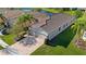 Aerial view of a well-maintained home with a tile roof and manicured lawn at 30174 Southernwood Ct, Wesley Chapel, FL 33543