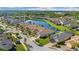 Stunning aerial view of homes near a serene lake at 30174 Southernwood Ct, Wesley Chapel, FL 33543